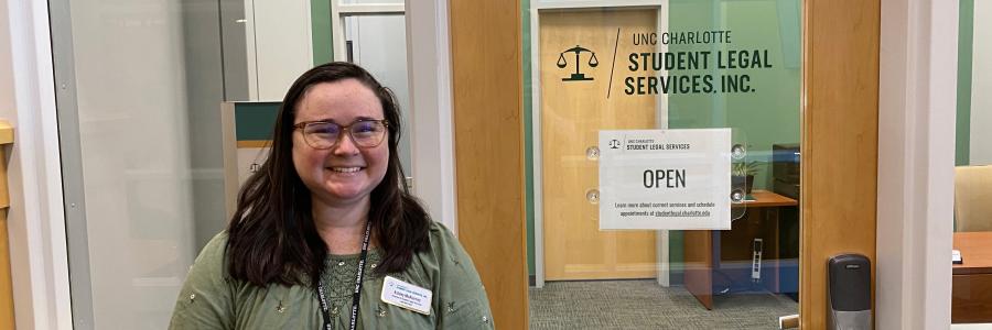 Woman standing in front of SLS office door